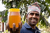 Nepal, Chitwan, beekeeper supported by the National Trust for Nature Conservation (NTNC) to improve the living standards of communities and reduce human pressures on the national park