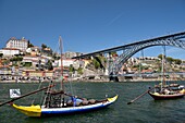 Portugal, North Region, Porto, historical center classified as World Heritage by UNESCO, historical district Cais de Ribeira, the Dom-Luis I bridge dominated by the cathedral and episcopal palace and built between 1881 and 1886 by engineer Theophile Seyrig disciple of Gustave Eiffel and who spans the river Douro