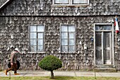 Chile, Los Lagos region, archipelago of Chiloe, Quinchao Island, Curaco de Velez, house facade with wooden shingles