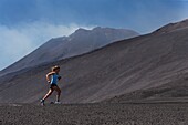 Italy, Sicily, Mount Etna Regional Nature Park, Mount Etna, UNESCO World Heritage Site, North Slope, eruption of July 27, 2019, woman practicing running