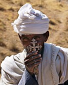 Ethiopia, Tigre region, portrait of an orthodox priest holding a cross