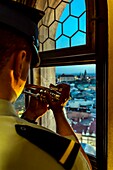 Poland, Voïvodie Lesser Poland, Krakow, Stare Miasto district, World Heritage Site, Old Town, fireman sounding the time change at the trumpet at the top of the belfry