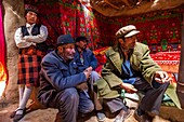 China, Xinjiang, Pamir highlands, pastures and semi nomadic tadjik communities of Taxkorgan, tadjik family, inside its house made of peat bricks