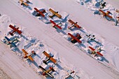 United States, Alaska, Small Aircraft Caught in the Snow at Anchorage Airport, from the Sky (aerial view)