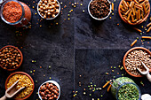 Selection of dried and canned legumes, and pasta made from legumes for plant-based whole food diet.