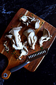 Fresh oyster mushrooms on cutting board,close-up