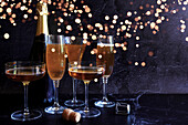 Champagne Celebration on Dark Background with Bokeh Lights, with Negative Space.