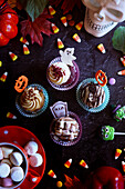 Halloween party cupcakes with marshmallow hot chocolate.