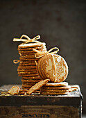 Fresh, crispy baked almond biscuits in a biscuit tin