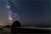 USA, Oregon, Cannon Beach. Haystack Rock with milky way overhead