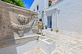 Mule walking through Kastro village street, Kastro, Sifnos Island, Cyclades, Greek Islands, Greece, Europe