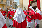 Confraternity of penitents gathering outside San Leonardo church, Enna, Sicily, Italy, Mediterranean, Europe