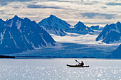 Guests from the Lindblad Expedition ship National Geographic Explorer kayaking in the Svalbard Archipelago, Norway, Arctic, Europe