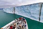 The Lindblad Expedition ship National Geographic Explorer near a glacier in the Svalbard Archipelago, Norway, Arctic, Europe