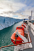 The Lindblad Expedition ship National Geographic Explorer near a glacier in the Svalbard Archipelago, Norway, Arctic, Europe