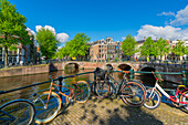 Bicycles by Keizersgracht canal, Amsterdam, The Netherlands, Europe