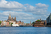 Basilica of Saint Nicholas and Chinese restaurant Sea Palace, Oosterdok, Amsterdam, The Netherlands, Europe