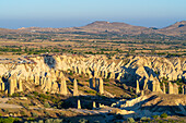 Aerial view of rock formations in Love Valley at sunrise, Goreme, Goreme Historical National Park, UNESCO World Heritage Site, Cappadocia, Central Anatolia Region, Anatolia, Turkey, Asia Minor, Asia