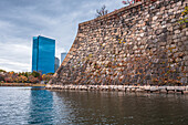 Osaka Castle walls and moat with The Crystal Tower, Osaka Business Park beyond, Osaka, Honshu, Japan, Asia