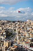 North-East district with the Jordanian flag on a 126m flagpole in front of the Raghadan Palace in the background, viewed from the top of Citadel Hill, Amman, Jordan, Middle East