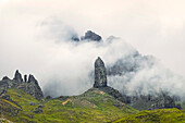 Skye's best known landmark, The Old Man of Storr, the 55m volcanic plug spire in swirling clouds below the Trotternish Ridge in the North East, The Old Man of Storr, Trotternish, Portree, Skye, Inner Hebrides, Scotland, United Kingdom, Europe