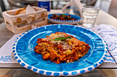 View of Italian lasagne on restaurant table, Island of Ischia, Campania, Italy, Europe