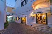 View of shops in Porto di Sant'Angelo at dusk, Sant'Angelo, Island of Ischia, Campania, Italy, Europe