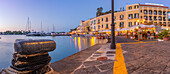 View of restaurants in Porto d'Ischia (Port of Ischia) at dusk, Island of Ischia, Campania, Italy, Europe