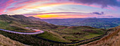 View of landscape and trail lights in the Hope Valley at sunset, Peak District National Park, Baslow, Derbyshire, England, United Kingdom, Europe