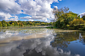 View of dramatic clouds refecting in Hardwick Ponds, Hardwick Park, Hardwick Hall, Bolsover, Derbyshire, England, United Kingdom, Europe