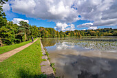 View of dramatic clouds refecting in Hardwick Ponds, Hardwick Park, Hardwick Hall, Bolsover, Derbyshire, England, United Kingdom, Europe