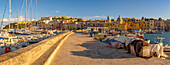 View of Church of Santa Maria della Pieta in the fishing port Marina Grande with boats at golden hour, Procida, Phlegraean Islands, Gulf of Naples, Campania, Southern Italy, Italy, Europe