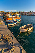 View of Church of Santa Maria della Pieta in the fishing port Marina Grande with boats at golden hour, Procida, Phlegraean Islands, Gulf of Naples, Campania, Southern Italy, Italy, Europe