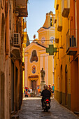 View of colourful narrow backstreet and Church of Santa Maria delle Grazie, Procida, Phlegraean Islands, Gulf of Naples, Campania, Southern Italy, Italy, Europe