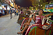 Cycle rickshaw (becak) driver in Malioboro Street, major shopping street, Yogyakarta, Java island, Indonesia, Southeast Asia, Asia