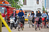 High school girls on a bike, Old Town of Semarang, Java island, Indonesia, Southeast Asia, Asia