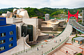 L'Arc Rouge (The Red Arch) by the French artist Daniel Buren on La Salve Bridge (The Prince and Princess of Spain Bridge) with the Guggenheim Museum designed by architect Frank Gehry, Bilbao, province of Biscay, Basque Country, Spain,, Europe