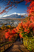 View over the city of Fujiyoshida, Mount Fuji and maples leaves in autumn, Fujiyoshida, Honshu, Japan, Asia