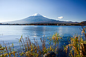 Mount Fujiyama (Mount Fuji), UNESCO World Heritage Site, ice capped volcano with a clear blue lake in fireground in autumn, Honshu, Japan, Asia