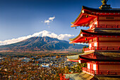 Vibrant sunrise at Five-storey pagoda, Chureito Pagoda, overlooking Fujiyoshida City and Mount Fuji volcano, Fujiyoshida, Honshu, Japan, Asia