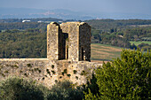 Watchtower on the city wall of the medieval walled town of Monteriggioni, Sienna, Tuscany, Italy.