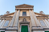 The facade of San Rocco church in Rome showcases its impressive classical design and historical significance.