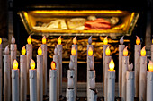 Rome, Italy, July 22 2017, The body of Saint Pius V rests in a beautiful basilica, surrounded by glowing candles that create a serene atmosphere.