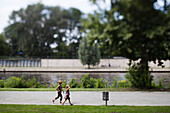 Berlin, Germany, July 29 2009, Kids are happily running by the Spree River, enjoying a sunny day in Berlin\'s Mitte district.