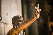 Lisbon, Portugal, March 1 2007, A sculpture of Saint Expeditus, a Roman soldier, holding a cross aloft in the serene interior of Graca church in Lisbon.