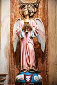 Lisbon, Portugal, March 1 2007, A striking sculpture of the Guardian Angel holds a chalice, symbolizing faith and devotion inside Encarnaao Church in Lisbon, Portugal.