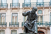 Explore the statue of Antonio Ribeiro, O Chiado, a famed satirical poet, situated outdoors in the vibrant streets of Lisbon.