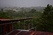 Heavy rains falling in Monteverde, seen through house window