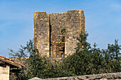 Watchtower on the city wall of the medieval walled town of Monteriggioni, Sienna, Tuscany, Italy.