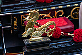 Detail of a gondola in Venice, Italy, showing a brass seahorse.